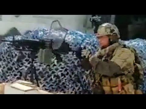Double handle machine gun grip on a M249 GEL BALL MACHINE GUN...This is very creative!
