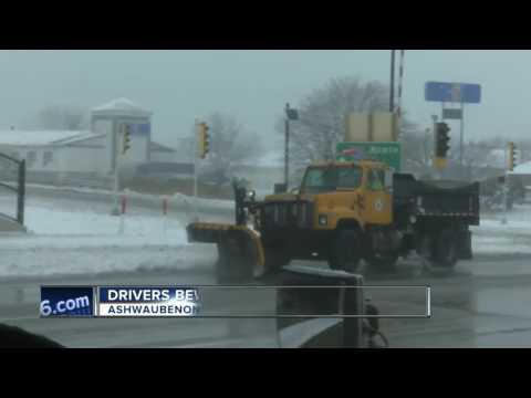 Plow crews working to clear ice and snow from roads