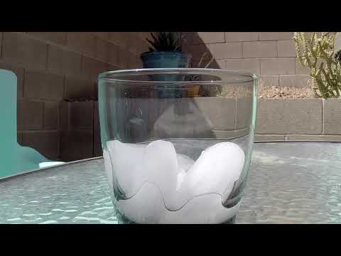 Ice melting in a glass for an hour.