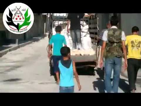 توزيع المعونات الإغاثية في حي طريق الباب في محافظة حلب من قبل لواء عمرو بن العاص