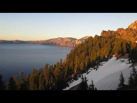 Sunset over the lake from a rocking chair view enjoying a craft beer behind the Crater Lake Lodge.  