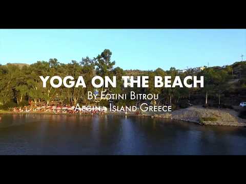 Yoga on Aeginitissa beach in Aegina island Greece