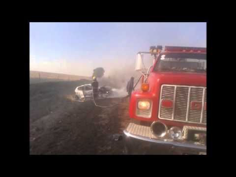 Car burns out due to veld fire
