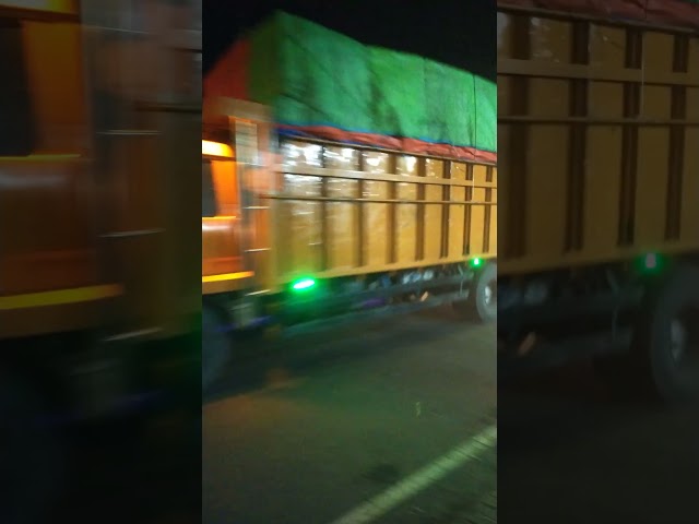 Fuso truck with full load covered by tarpaulin towards Jepara city