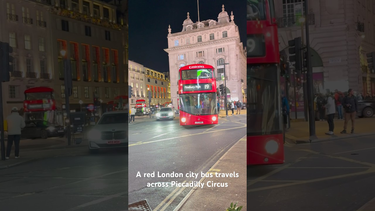 A red London city bus travels across Piccadilly Circus #bus #redbus #londonbus #doubledecker