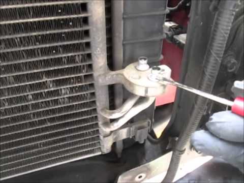 Air injection system control valve location in the KIA Besta...