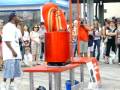Same Street Performer Going Into A Cylinder