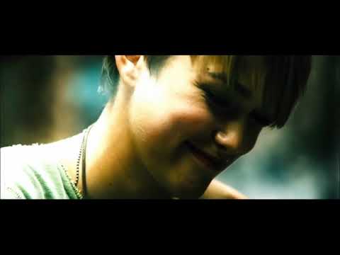 Domino (2005) trailer frame with Keira Knightley aiming a shotgun in Tony Scott’s neon smear