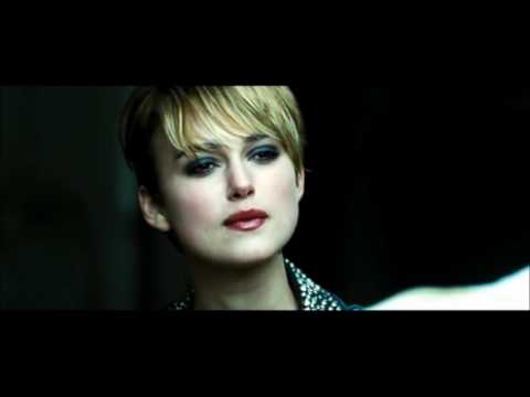 Trailer still: fast shutter streaks and green-gold palette typical of Tony Scott’s late-period style