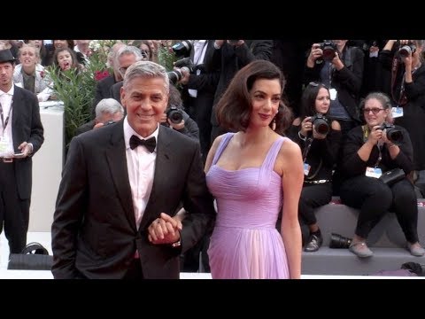 George Clooney and his wife Amal on the red carpet for the Premiere of Suburbicon