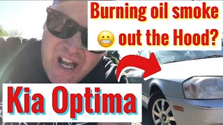 2002 Kia Optima diagnose oil leak burning and valve cover gasket. Remove and Replace GASKET.