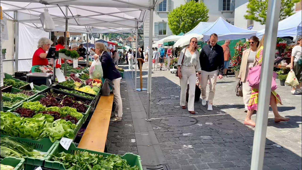 Explore a treasure trove of culinary delights, from farm-fresh vegetables to Swiss chocolates, all in one lively marketplace.