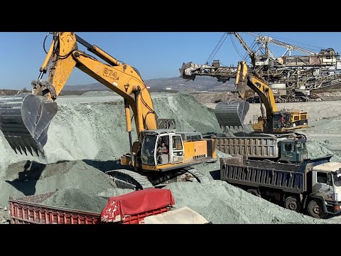 Liebherr 974 Excavator And Caterpillar 385C Excavator Loading Trucks