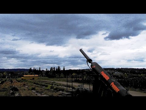 Halloween Fun Shooting Pumpkins at an Old School Bus