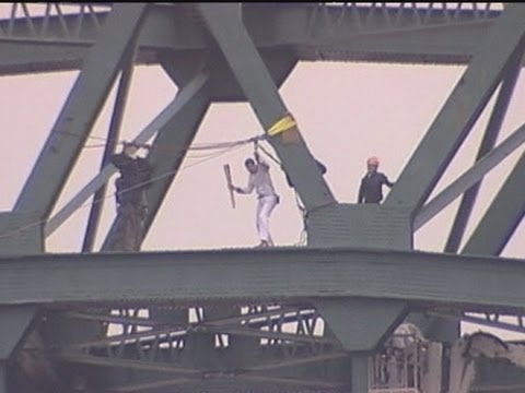 Bear Grylls zipwires from Tyne Bridge with Olympic Torch