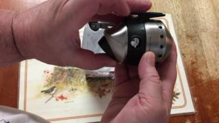 How to take the cover off a  Zebco spincast reel