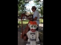 Harp man playing for Zozobra