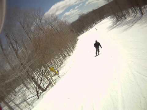 3/26/11 Big Man sneaking up on former Canadian Team racer John railing Head skis.