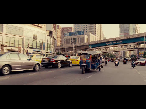 Trailer frame reflecting the jump from grimy hotel wake-up to high-gloss party sequences