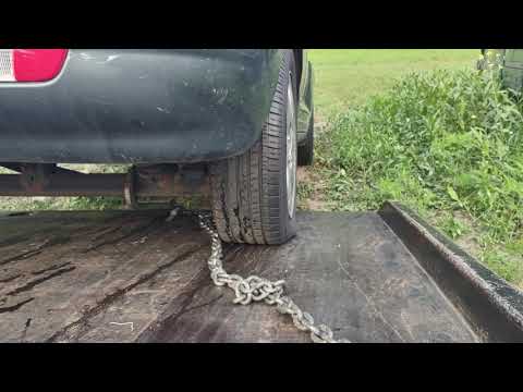 How to unload a car off a flatbed that doesn't want to come off