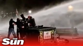 Download lagu Riot police turn water cannons and tear gas on pro... mp3