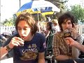 Julian Casablancas skulling a shot, drinking a beer, and smoking a cig
