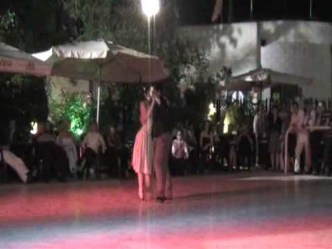  Pamela Ramos Aracena  and  Carlos Espinoza  are  dancing  to  a  vals