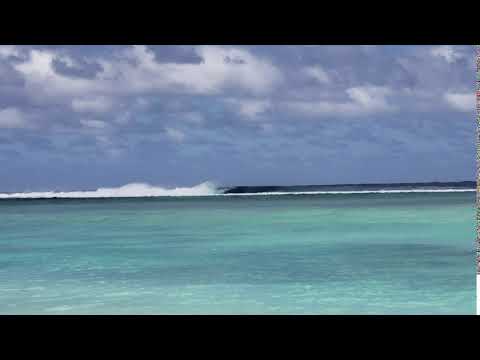 Surf breaking on the outer reef, west Rarotonga