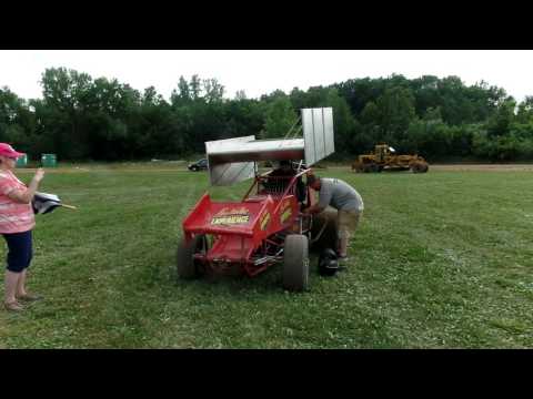 Jon B climbing into sprint car