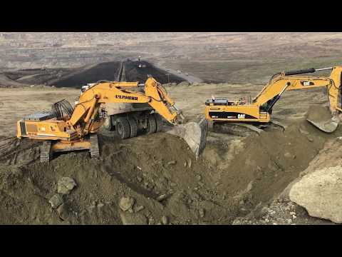 Liebherr 974 And Caterpillar 385C Excavators Loading Trucks And Dumpers
