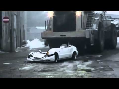 Bulldozer make mercedes in to metall ball