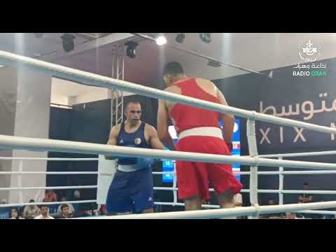 انهزام الملاكم الجزائري #شعيب بولودينات أمام المصري #حافظ يسري في الدور النصف النهائي