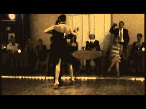  Adrian Costa  and  Amanda Costa  are  dancing  to  the  tango  "  Indiferencia  "