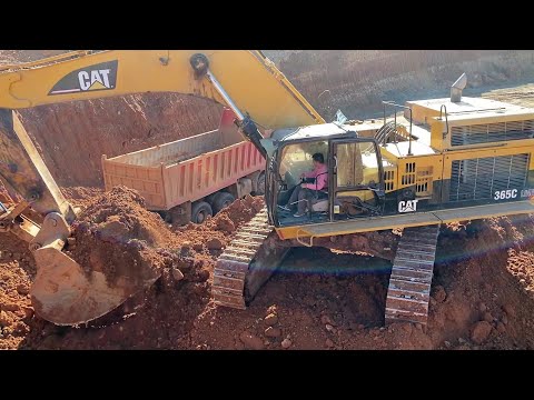 Caterpillar 365C Excavator Loading Mercedes And MAN Trucks
