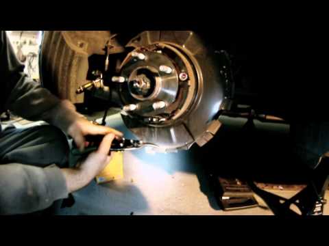 brembo rear install - cutting dust shield - Genesis coupe.wmv