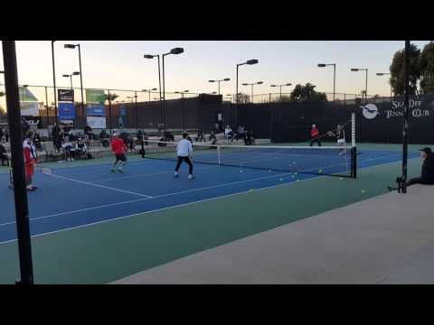 Karl Akkerman hitting a behind the back winner at the USPTA Convention