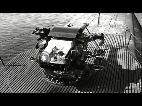 The features of a new five-inch-twenty-five Caliber gun are shown after a submari...HD Stock Footage