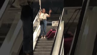 Suitcase Slides Down Escalator || ViralHog