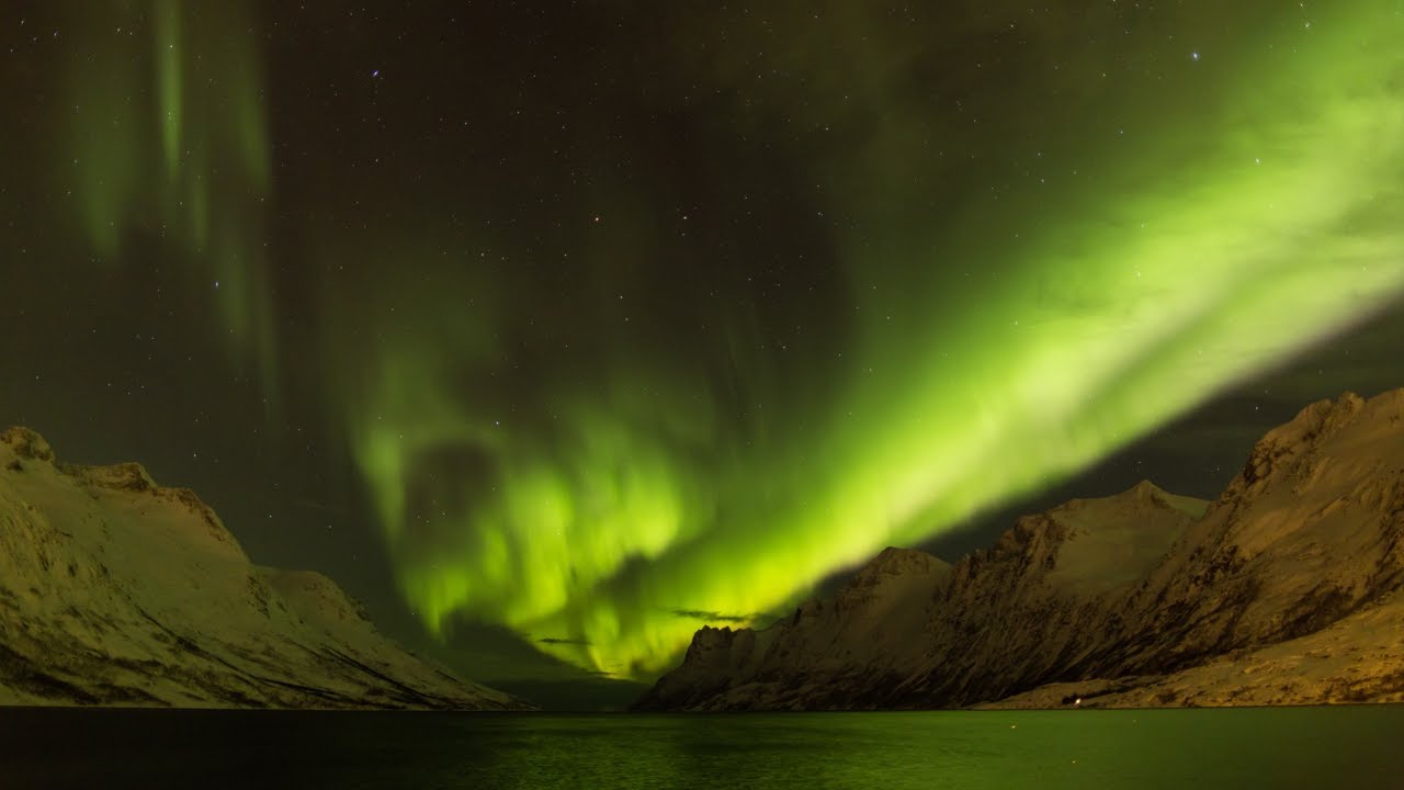 Timelapse of the Aurora Borealis over a fjord, Troms, Norway, March 2016.