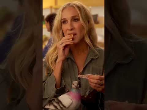 Only Carrie Bradshaw can walk through NYC holding a full-on pigeon clutch