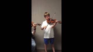 Eric with a beginning violin student