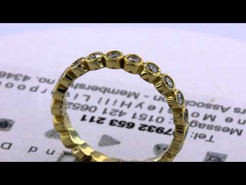 3 quarter carat diamond set rub over full eternity ring in 18ct yellow gold.