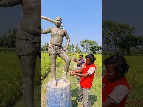Put the rope on the feet of the idol.13