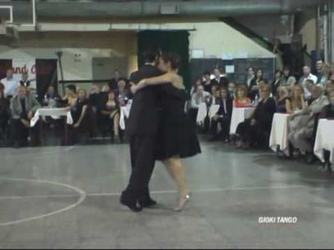  Paola Tacchetti  and  Alejandro Hermida  are  dancing  to  the  milonga  "  Milonga De Los Fortines  "