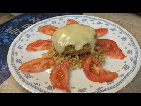 Old Fashioned Crab Cake , Topped With Cream Of Chicken And Brown Rice