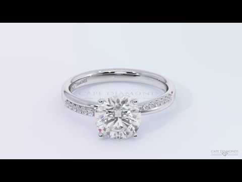 Unique cross over side stone  four claw twist engagement ring platinum white gold