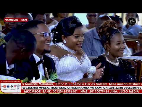 Archbishop Ruwa'ichi congratulates the composer of the song "MKATOLIKI" and orders the choir to s...