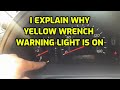 I EXPLAIN WHAT CAUSE THE YELLOW WRENCH WARNING LIGHT TO TURN ON