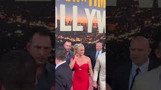 Britney Spears arrives at the Once Upon a time in Hollywood red carpet in a red dress
