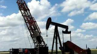 preview picture of video 'Cooper Workover Rig Raising Derrick On Oil Well Pt.1'